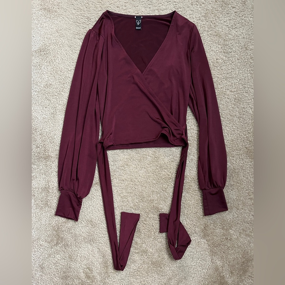 Dark red low cut long sleeve top with wrap around detail